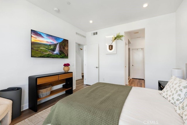 bedroom featuring visible vents, recessed lighting, and wood finished floors