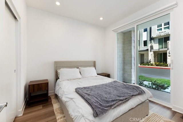 bedroom featuring recessed lighting, baseboards, and wood finished floors