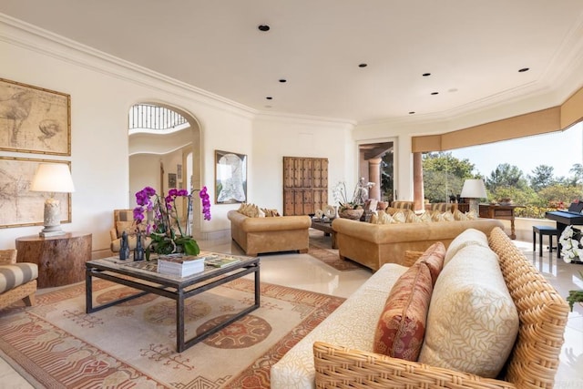 living area featuring crown molding, recessed lighting, and arched walkways