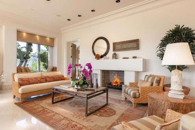 living room featuring marble finish floor, a lit fireplace, and ornamental molding