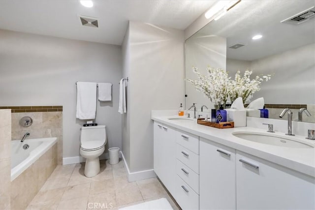 full bath featuring a bath, visible vents, toilet, and a sink