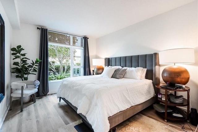 bedroom featuring light wood-style floors