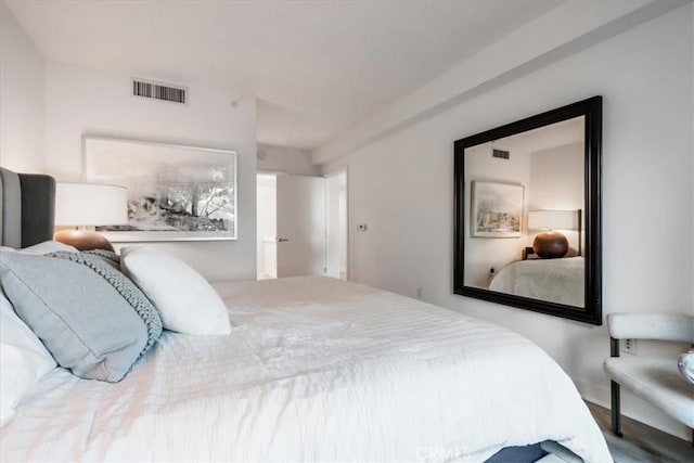 bedroom featuring visible vents