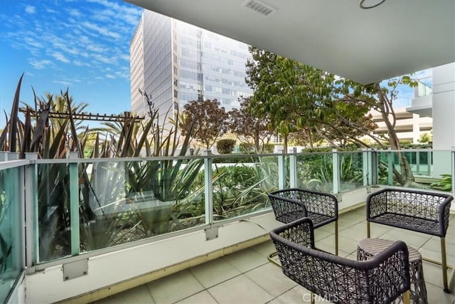 balcony featuring visible vents and a sunroom