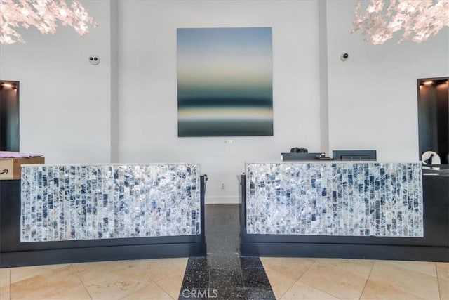 bathroom with tile patterned floors and baseboards