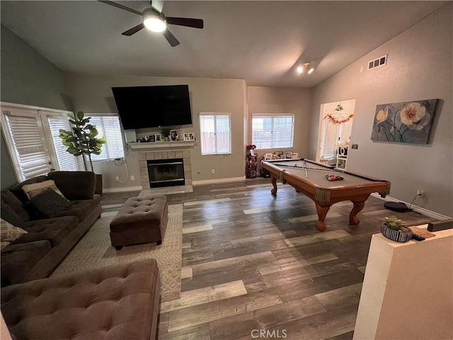 game room featuring visible vents, lofted ceiling, plenty of natural light, and wood finished floors