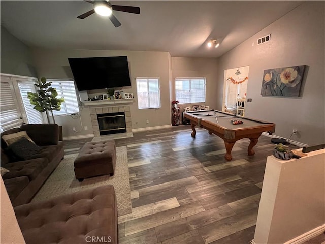 recreation room with visible vents, plenty of natural light, lofted ceiling, and wood finished floors