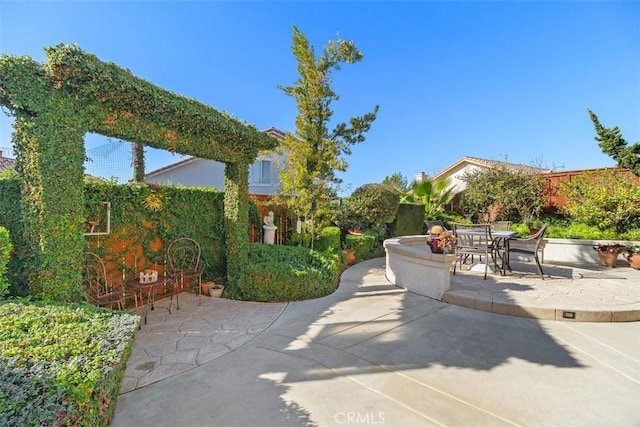 view of patio / terrace featuring outdoor dining area and fence