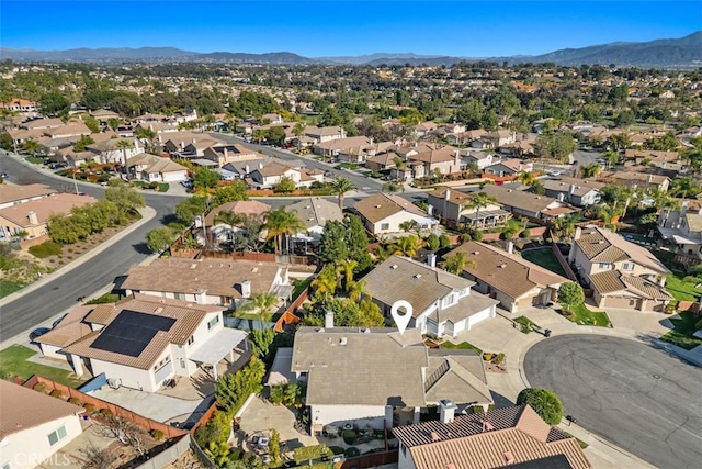 birds eye view of property with a mountain view and a residential view