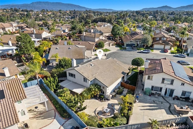 birds eye view of property with a mountain view and a residential view