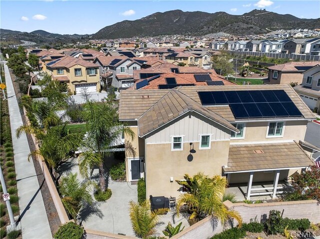 birds eye view of property featuring a mountain view and a residential view