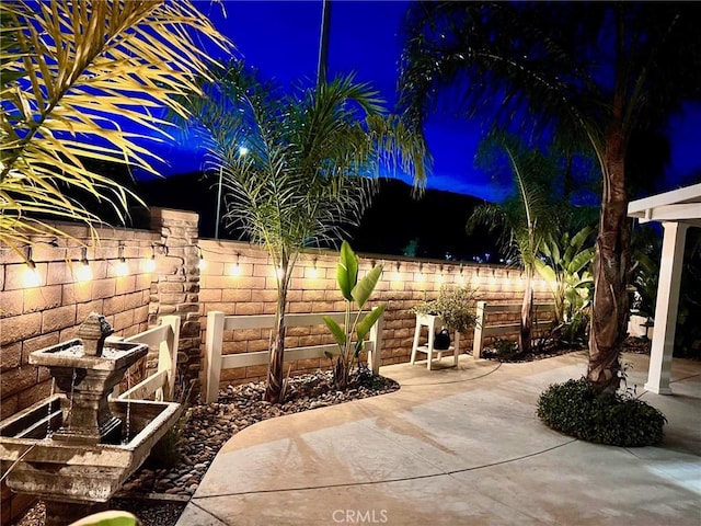 patio at night with fence