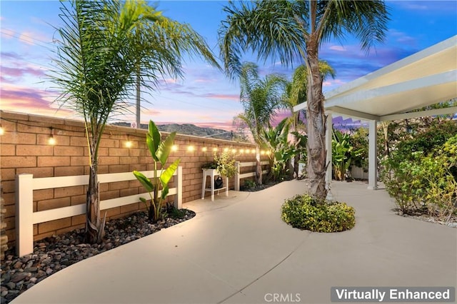 view of patio / terrace featuring fence