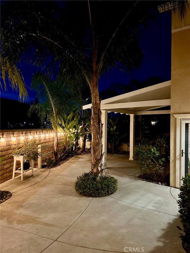 patio at night with fence