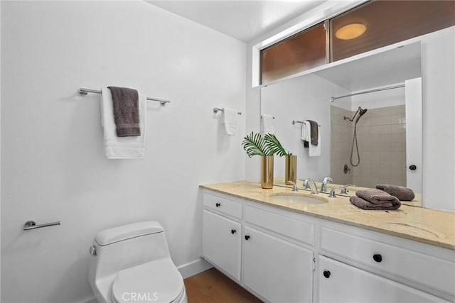 11328 Felson St, Cerritos, CA 90703 - bathroom featuring vanity, toilet, a tile shower, and baseboards