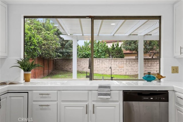 view of patio featuring exterior kitchen, a fenced backyard, a pergola, and a sink