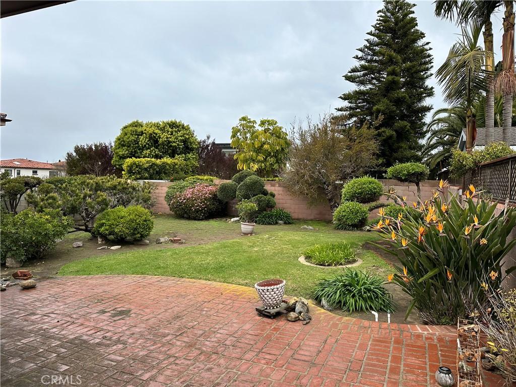 view of yard with a fenced backyard and a patio area