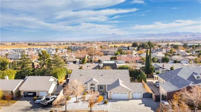 birds eye view of property with a residential view and a mountain view