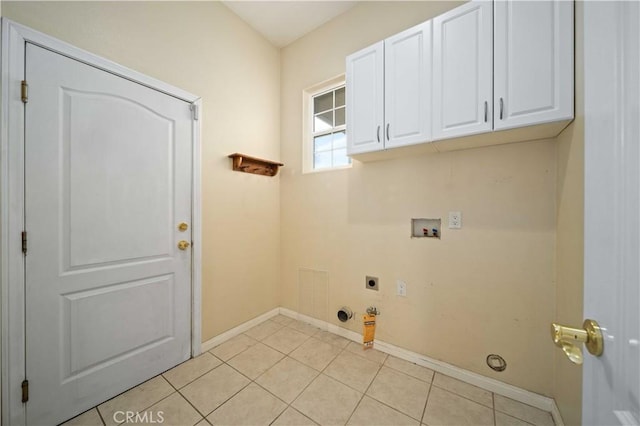 laundry area featuring visible vents, washer hookup, light tile patterned floors, cabinet space, and hookup for an electric dryer