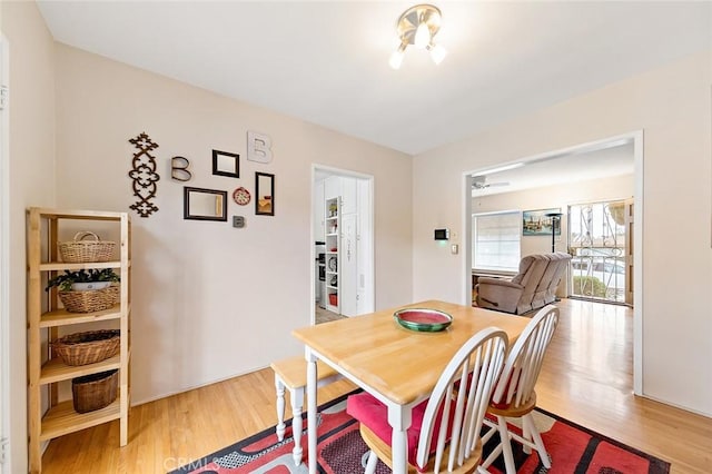 dining area featuring light wood-type flooring