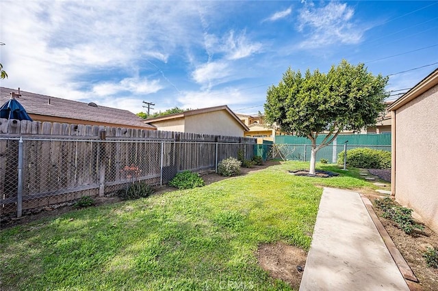 view of yard with a fenced backyard