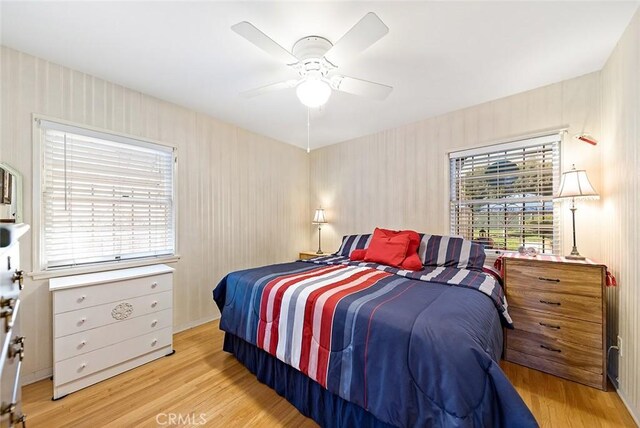 bedroom featuring ceiling fan and wood finished floors