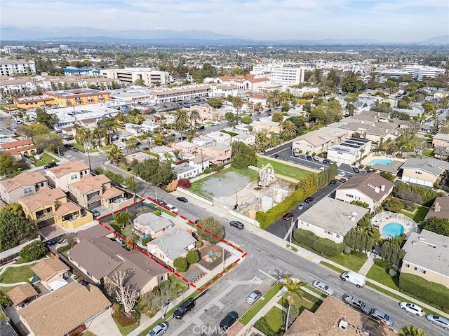 birds eye view of property with a residential view