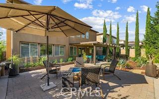 view of patio / terrace with a pergola and outdoor dining area