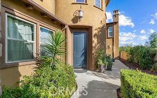 entrance to property with stucco siding