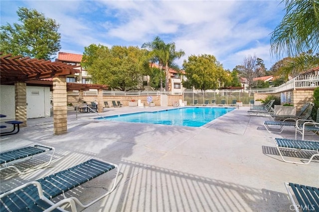 pool featuring a patio area, fence, and a pergola