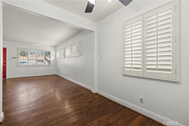 spare room with baseboards, a ceiling fan, and hardwood / wood-style flooring