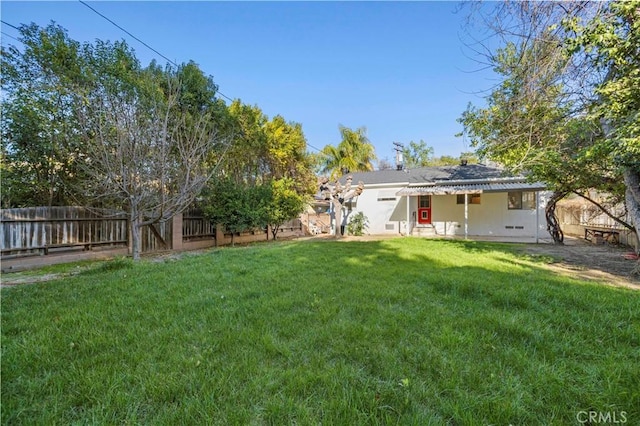 view of yard with a patio and a fenced backyard