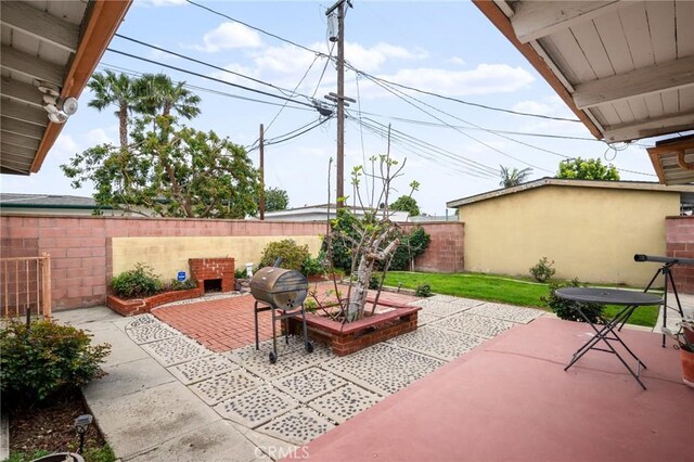 view of patio featuring a grill and a fenced backyard