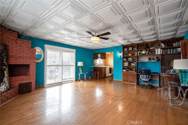 office featuring an ornate ceiling, ceiling fan, and wood finished floors