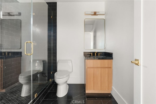 full bathroom featuring vanity, toilet, baseboards, and a stall shower