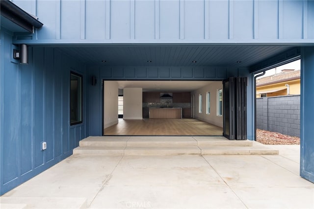 exterior space featuring driveway and fence