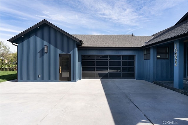 exterior space featuring concrete driveway