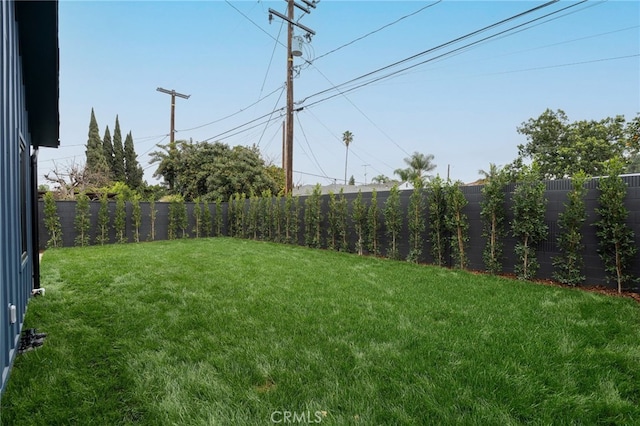 view of yard with a fenced backyard