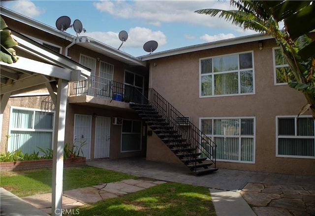 view of property featuring stairs