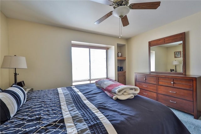 carpeted bedroom featuring a ceiling fan