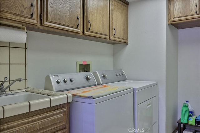 laundry room featuring washer and dryer and cabinet space