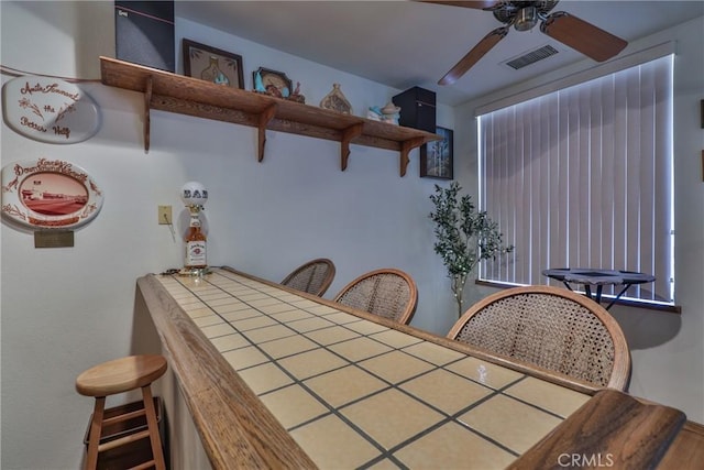 dining room featuring visible vents and ceiling fan