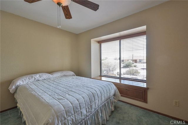 carpeted bedroom with baseboards and ceiling fan