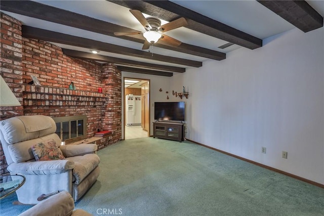 unfurnished living room featuring beamed ceiling, carpet flooring, a fireplace, and baseboards