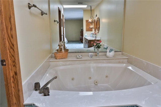 full bathroom with visible vents, connected bathroom, and a whirlpool tub