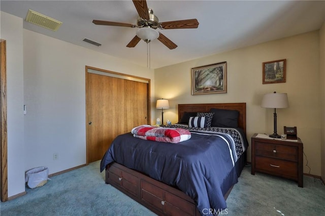 bedroom featuring carpet flooring, baseboards, visible vents, and a closet