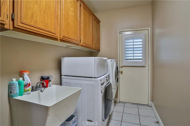 1412 San Clemente Cir, Corona, CA 92882 - laundry room with cabinet space, a sink, light tile patterned floors, baseboards, and washer and dryer