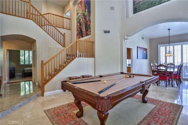 1412 San Clemente Cir, Corona, CA 92882 - rec room featuring arched walkways, a high ceiling, visible vents, and baseboards