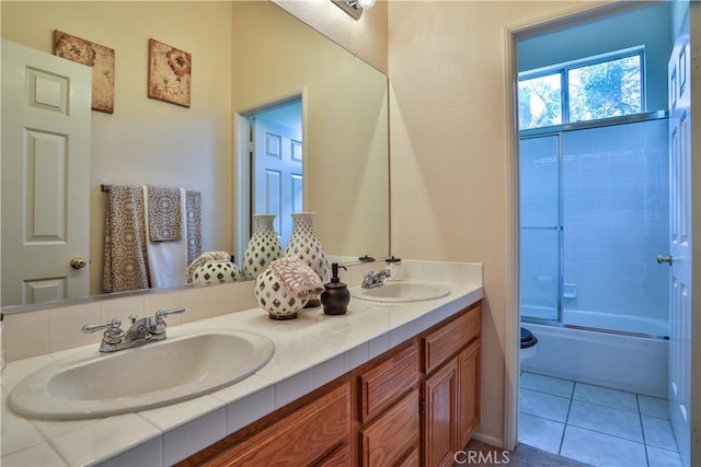 1412 San Clemente Cir, Corona, CA 92882 - full bath featuring double vanity, a sink, tile patterned floors, and bath / shower combo with glass door