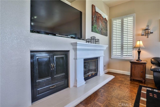 1412 San Clemente Cir, Corona, CA 92882 - living room featuring a glass covered fireplace and baseboards
